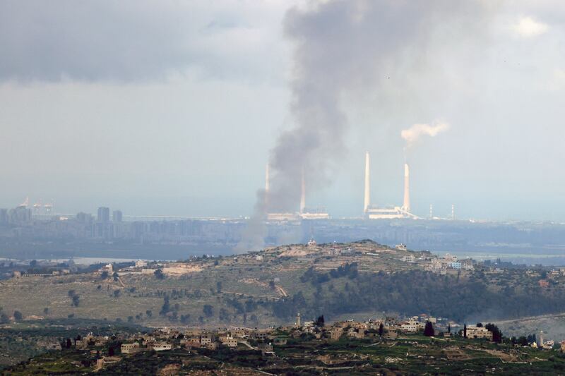 Smoke billows after a projectile landed in an area between the West Bank and the Israeli city of Hadera on Thursday. Photograph: Alaa Badarneh/European Pressphoto Agency