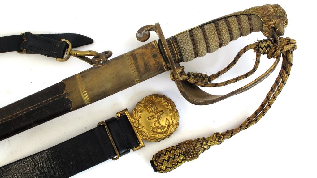 The Royal Navy Reserve officer’s sword owned by and inscribed for Erskine Childers.