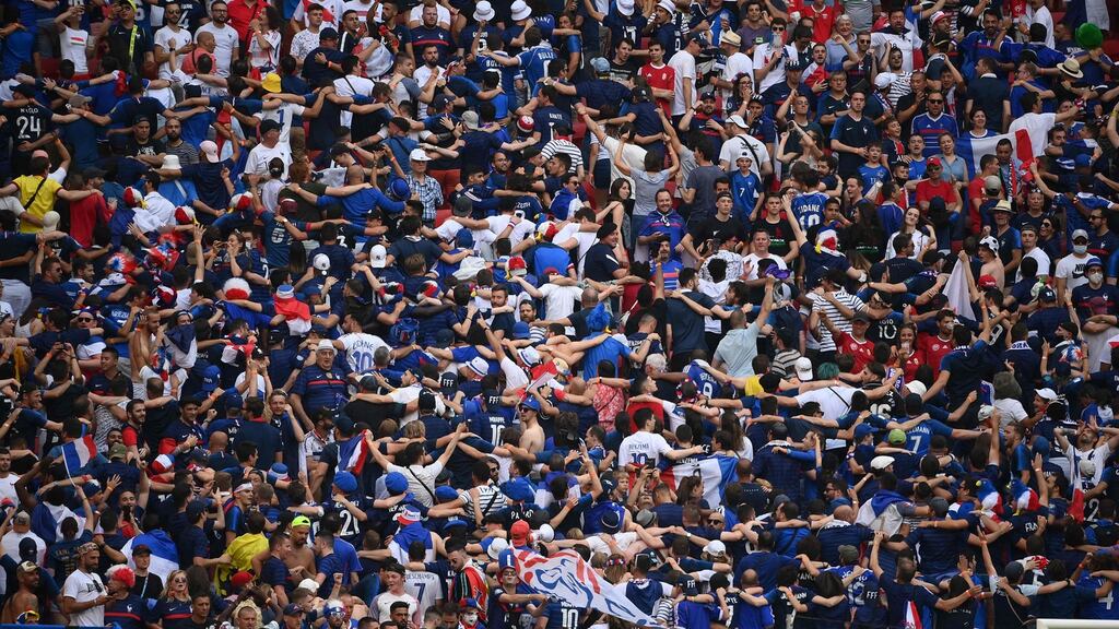France fans cheer on their team at the Puskas Arena in Budapest. Photograph: Getty Images