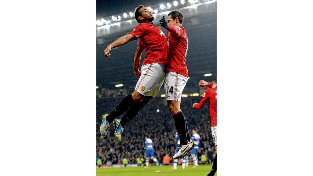 Manchester United striker Javier Hernandez (right) celebrates scoring his side's second goal with team-mate Anderson during last night's FA Cup fifth round tie against Reading at Old Trafford. photograph: paul ellis/afp/getty images