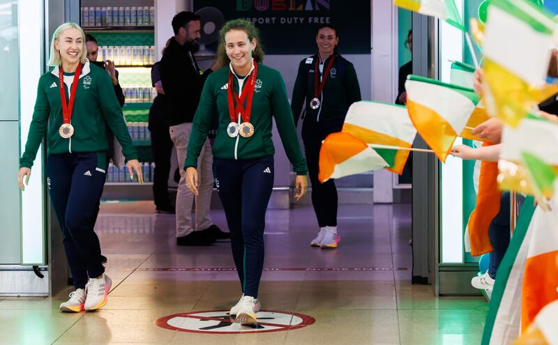 Orla Comerford and Róisín Ní Ríain at the Team Ireland Paralympics homecoming at Dublin Airport. Photograph: James Crombie/Inpho