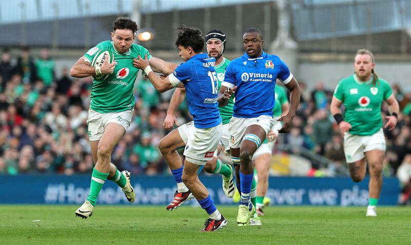 Ireland's Hugo Keenan is held by Ange Capuozzo during the Six Nations match between Ireland and Italy at the Aviva Stadium on February 11th. Photograph: David Rogers/Getty Images