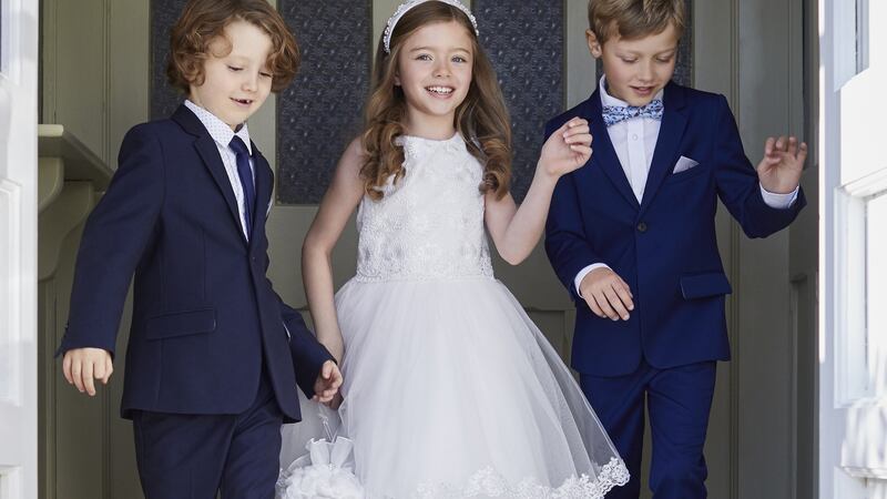 Hayley: dress, €100; beaded hairband €15 by Paul Costelloe for Dunnes Stores. Boys’ blazer, €40, waistcoat, €20, trousers,  €25, shirt €20, navy tie and bow tie, €5 each.