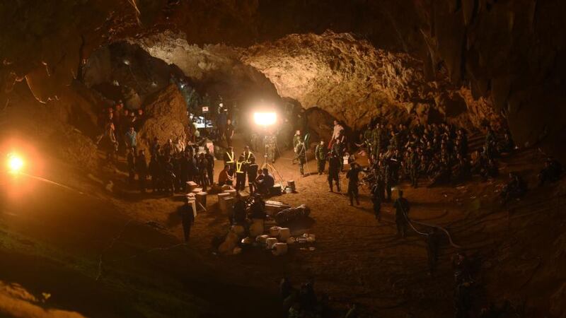 Thai cave rescue: soldiers lay electric cable deep into the maze of tunnels before starting to bring the Wild Boars soccer team back to safety. Photograph: by Lillian Suwanrumpha/AFP/Getty