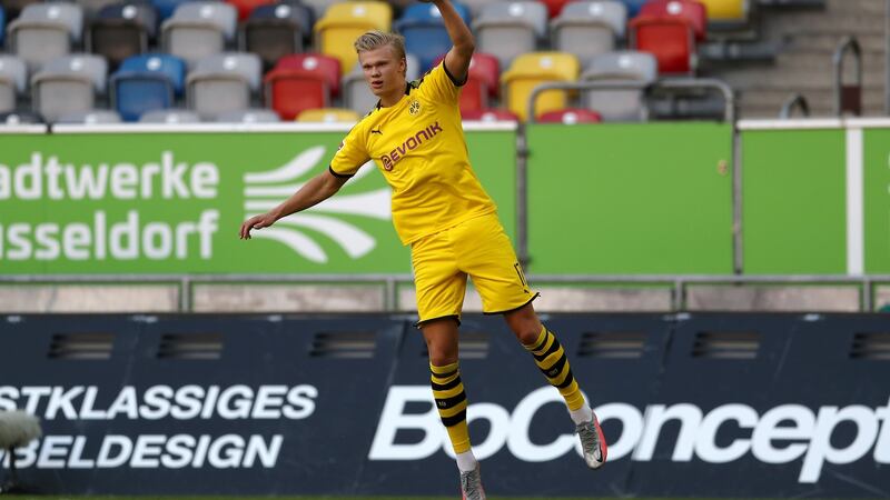 Erling Haaland celebrates after scoring Dortmund’s later winner against Fortuna Dusseldorf. Photograph: Lars Baron/EPA