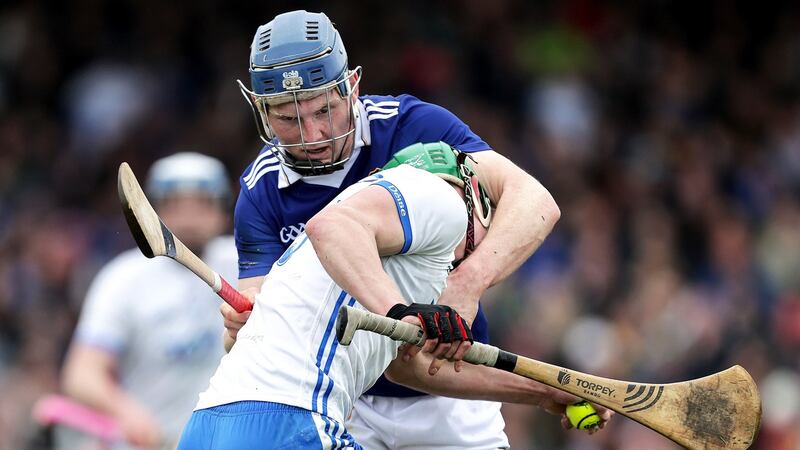 Waterford’s Michael Kiely and James Quigley of Tipperary get well acquainted. Photograph: Laszlo Geczo/Inpho