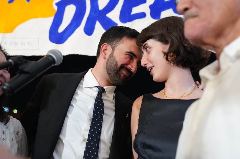 Zohran Mamdani celebrates with his wife, Rama Duwaji, at a Democratic primary night gathering in New York on Tuesday. Photograph: Shuran Huang/New York Times