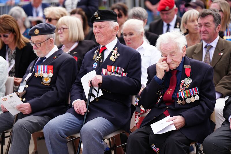 (L-R) Alan Kennett, Stan Ford and Albert Keir during the veterans parade on the sea front in Arromanches, Normandy, France, during the anniversary event. Photograph: Jane Barlow/PA Wire