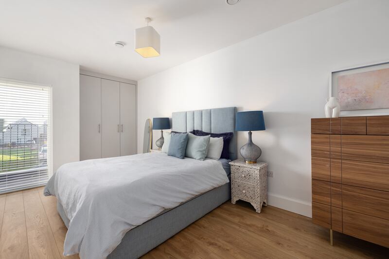 Bedroom two, with access to shared balcony to the front