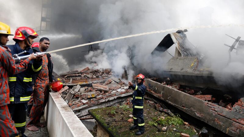 Firefighters work to put out a fire at a packaging factory in the Tongi industrial area outside Dhaka, Bangladesh on Saturday. Photograph: AM Ahad/AP Photo