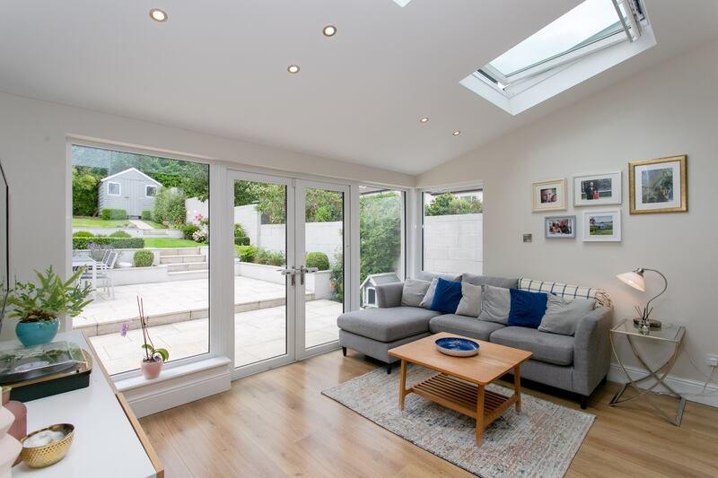Living area to the rear opening out onto a large tiered patio. Photograph: Brian Dempsey