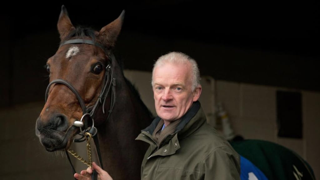 Hurricane Fly with his trainer Willie Mullins, award winners yesterday.