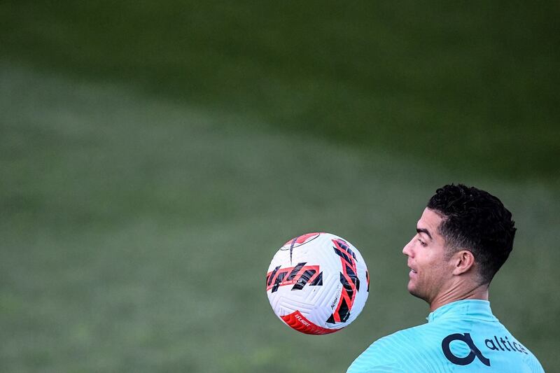 Portugal’s Cristiano Ronaldo eyes the ball during a training session at the Cidade do Futebol training camp in Oeiras, outside Lisbon. Photograph: Patricia de Melo Moreira/AFP via Getty Images