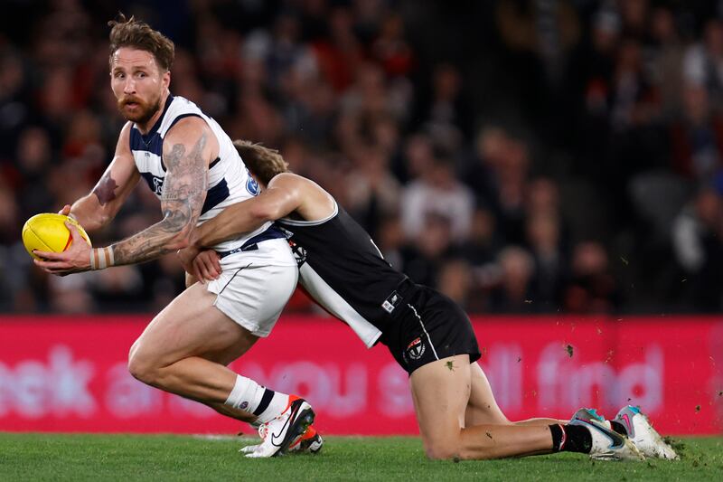 Dan Butler of St Kilda Saints tackles Zach Tuohy of Geelong Cats during an AFL match in 2023 in Melbourne, Australia. Photograph: Darrian Traynor/Getty Images