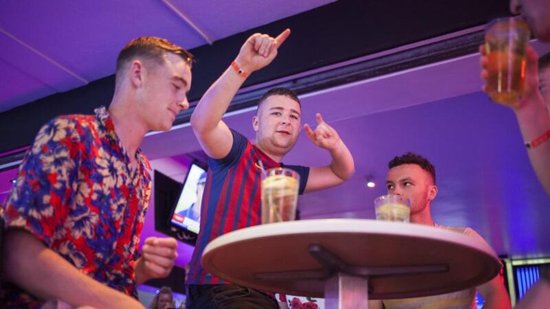 Magaluf: a group at a bar on the Strip. Photograph: Tomeu Coll