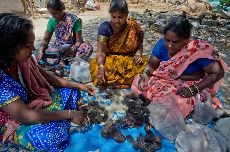 Women sort through hair in Bangalore