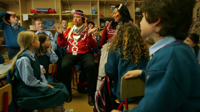 Gary and Janie White Deer of the Choctaw nation in Oklahoma talk to pupils of Gaelscoil Cholmcille, Santry, Dublin. about the Irish famine in 1847, when their ancestors sent $170 in aid. Photograph: Kate Geraghty
