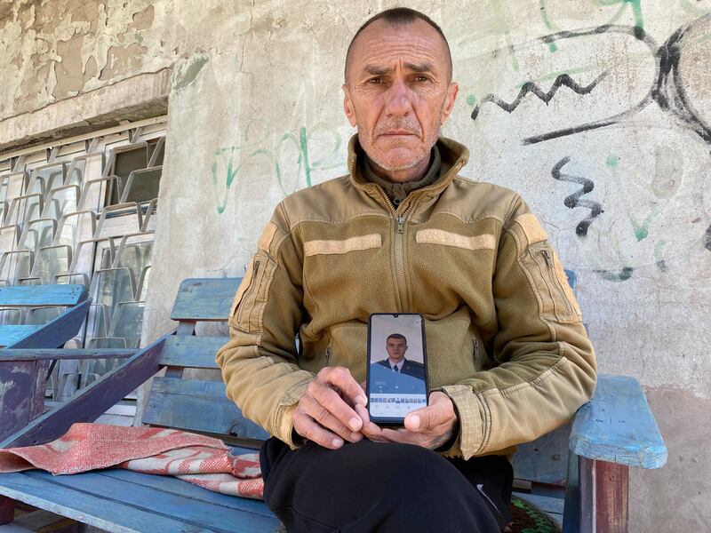 Oleksandr Yurychko shows a photograph of his son Oleksandr jnr, a lieutenant fighting in Donetsk. Photograph: Lara Marlowe