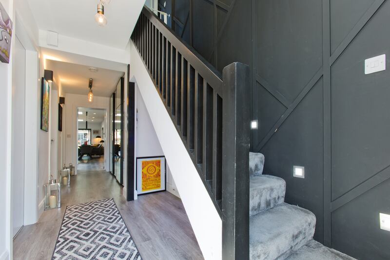 The large open space under the stairs is handy for storage.