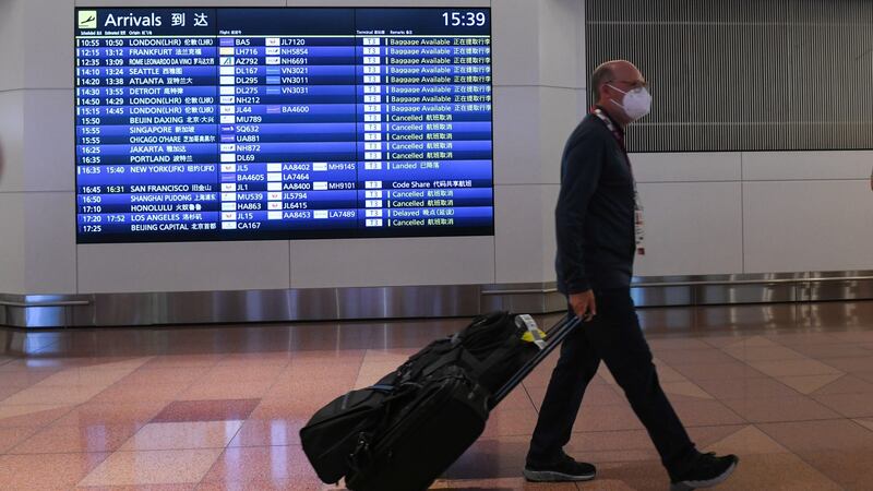 A traveler at  Haneda Airport in Tokyo, Japan. Photograph: Noriko Hayashi/Bloomberg