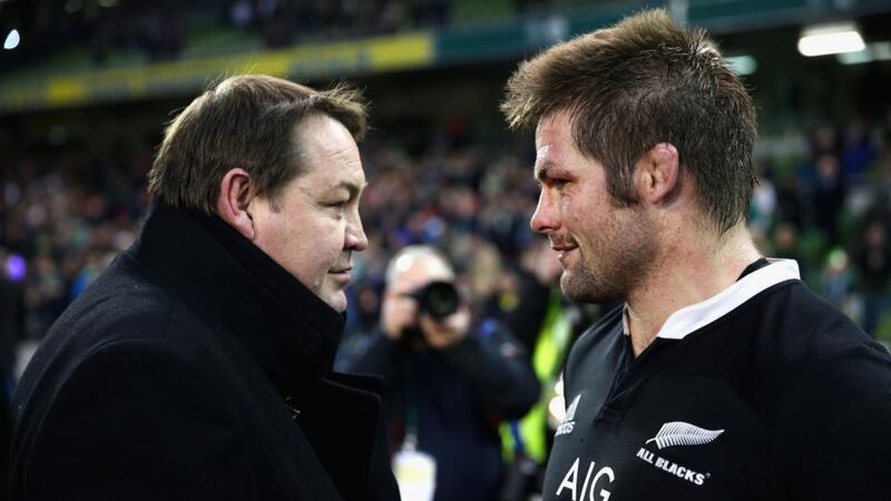 All Black coach Steve Hansen (left) talks with captain Richie McCaw after their 14th win of the year in Dublin last month.  Hansen was named coach of the year by the IRB. Photograph: Phil Walter/Getty Images