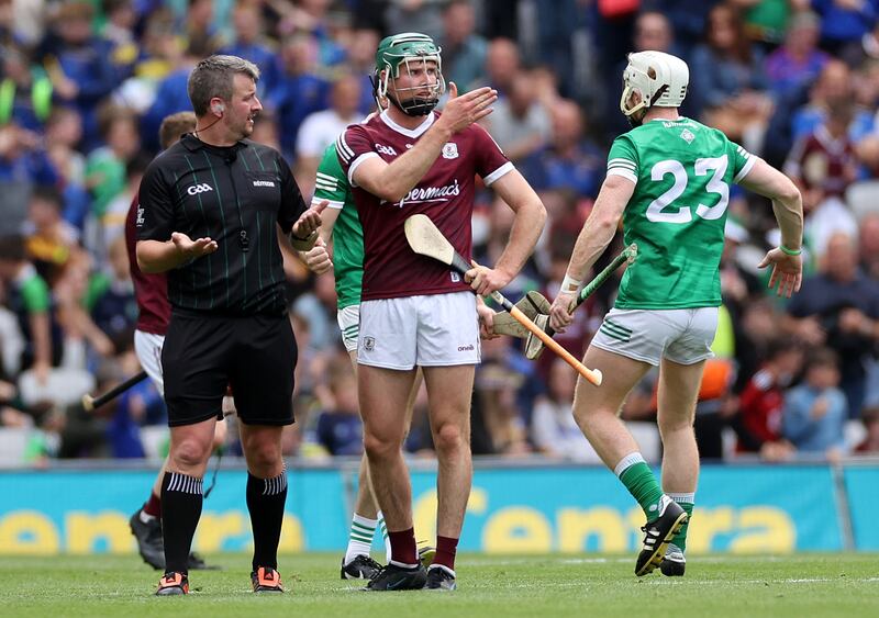 Referee Thomas Walsh speaks to Cathal Mannion of Galway. Photograph: James Crombie/Inpho