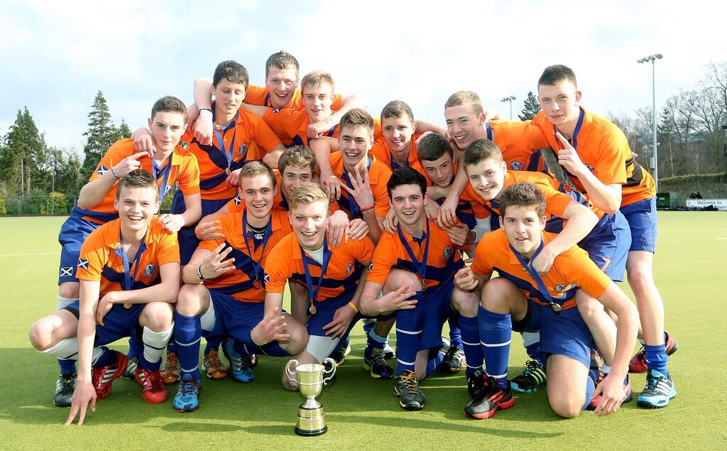 The St Andrew’s team celebrate with the cup after defeating Wesley in the Leinster Schoolboys Hockey Senior Cup final at Three Rock Rovers, Grange Road, Dublin, yesterday. Photograph: Inpho