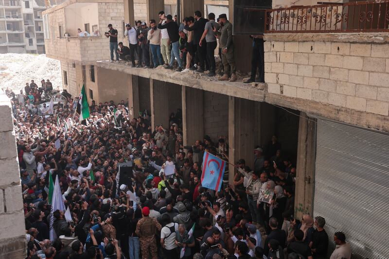 Syrians celebrate after the arrest of Youssef in the Tadhamon neighbourhood of Damascus on Friday. Photograph: Mohammed Alrifai/EPA