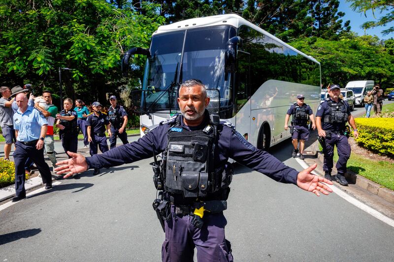 Police officers clear the road for a departing bus transporting members of the Iranian Women's Asia Cup football team to the airport, after members of the Iranian community in Australia attempted to block its path Photograph: Getty Images