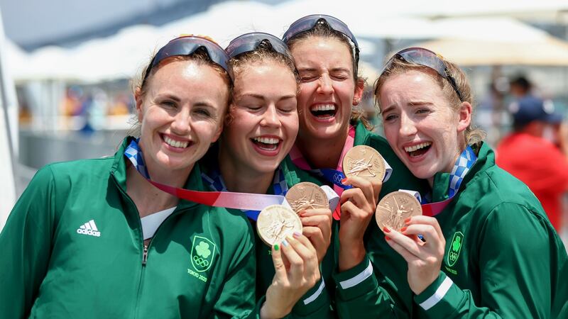 Ireland’s Eimear Lambe (second from left) and her rowing team-mates Aifric Keogh, Fiona Murtagh and Emily Hegarty celebrate with their bronze medals. Photograph: Morgan Treacy/Inpho