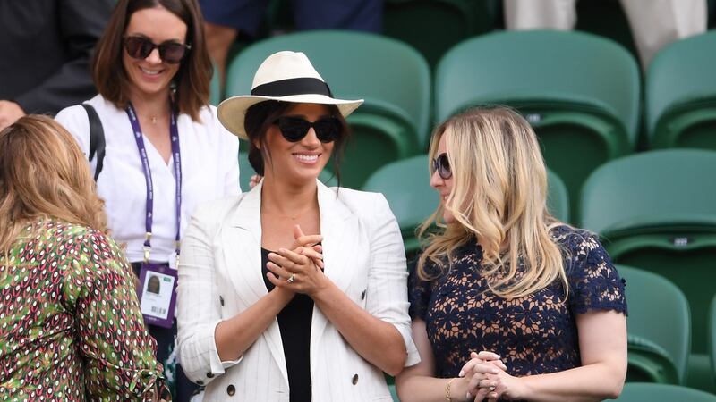 Meghan Markle, Duchess of Sussex went for a more casual look, with oversized sunglasses and an A necklace for her son Archie. Photograph:  Laurence Griffiths/Getty Images