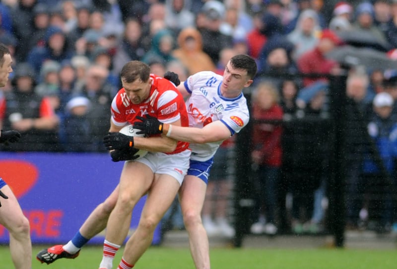 Louth’s Sam Mulroy in challenged by Monaghan's Micheal McCarville. Photograph: Ciaran Culligan/Inpho