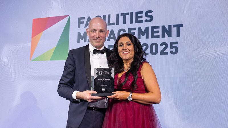 Ronan McDonnell, operations director at SOS Group, presents the diversity and inclusivity award award to Sarah Hunt, Sodexo Ireland