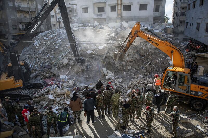 Rescue workers search for survivors in the rubble of a collapsed building in the town of Jableh in Syria's northwestern province of Latakia, earlier today. Photograph: AFP via Getty Images