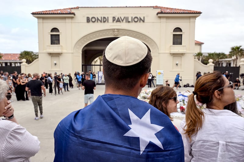 Mourners gather to pay a floral tribute to Bondi Beach shooting victims at the Bondi Pavilion in Sydney. Photograph: Saeed Khan/AFP/Getty Images