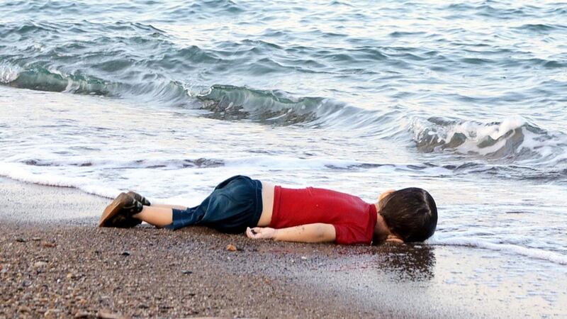Alan Kurdi’s body lying on the shore in Bodrum, southern Turkey, after a boat carrying refugees sank while heading to the Greek island of Kos. Photograph: Nilufer Demir/AFP/Getty Images