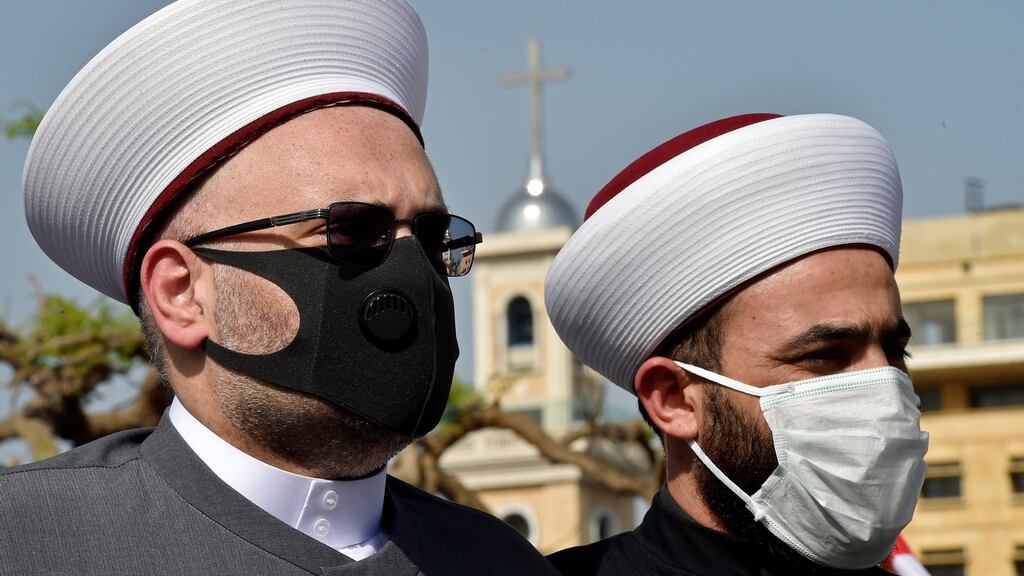 Lebanese Sunni clerics wear protective face masks as they attend a protest in solidarity with the Palestinians in Jerusalem and the West Bank in front of the headquarters of the United Nations in Beirut last week. Photograph: Wael Hamzeh