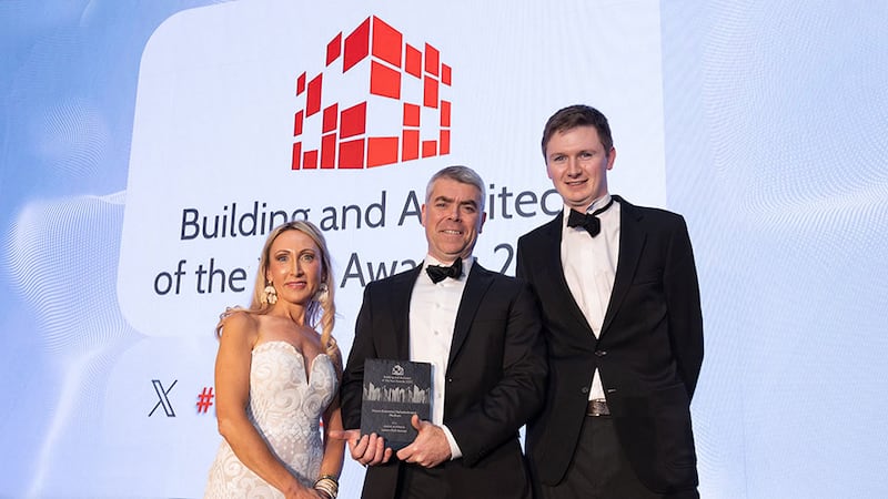 Johann Muldoon, awards judge, presents the house extension refurbishment - medium award to Mícheál de Siún and Ross Melbourne, Desiun Architects