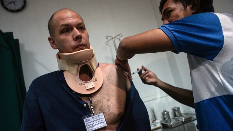 Australian journalist Adam Harvey  receives medical treatment from a gunshot wound on Thursday as fighting between Islamist militants and government forces continues on Mindanao Island in the  southern Philippines. Photograph: Linus G Escandor II/EPA