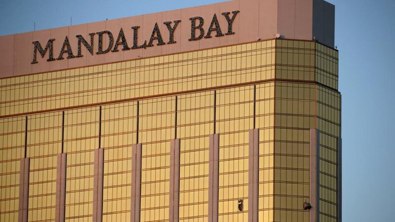 Mandalay Bay massacre: curtains blow from broken windows at the Mandalay Bay in Las Vegas. Photograph: John Locher/AP