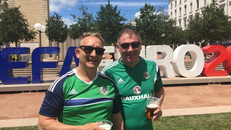 Going all out: Michael Surgeon from Donegall Road in Belfast  and Norman Martin from Sandy Row in Belfast near the  fan zone in Lyon ahead of today’s  critical game against Ukraine in Euro 2016. Photograph: Gerry Moriarty