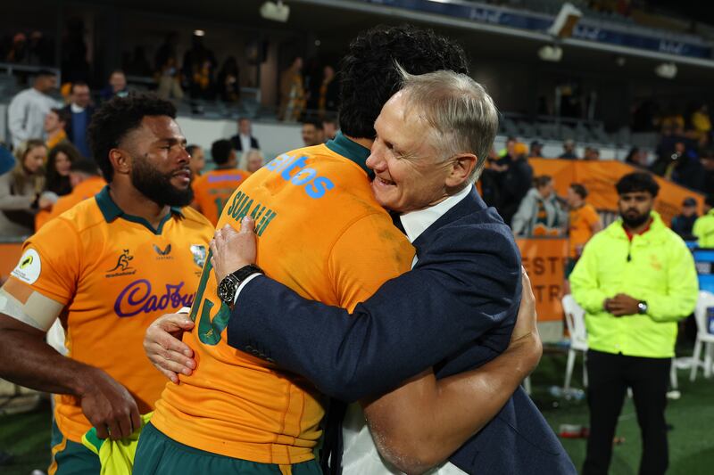 Australia head coach Joe Schmidt embraces Joseph-Aukuso Suaalii after the Wallabies' win over Italy. Photograph:  Paul Kane/Getty Images
