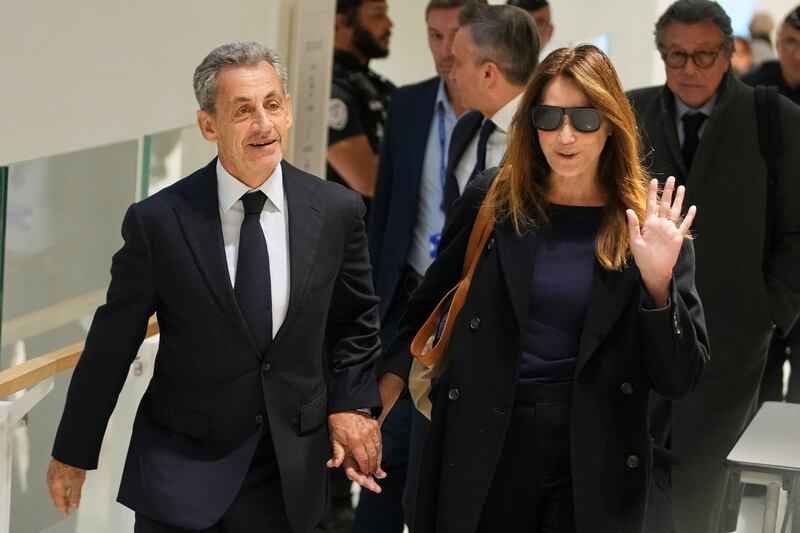 Nicolas Sarkozy and his wife Carla Bruni-Sarkozy arriving at court in Paris on Thursday. Photograph: Christophe Ena/AP