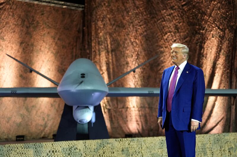 US president Donald Trump stands beside an MQ-9 Reaper drone  at the Al Udeid Air Base in Doha, Qatar. Photograph: Alex Brandon/AP