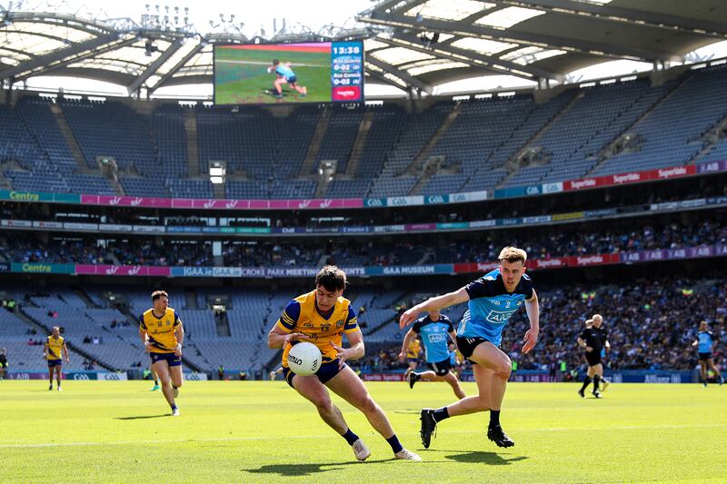 Roscommon's Ben O’Carroll with Daire Newcombe of Dublin. At one stage Roscommon kept the ball for over six minutes at Croke Park, before finally kicking a score. Photograph: Ben Brady/Inpho 