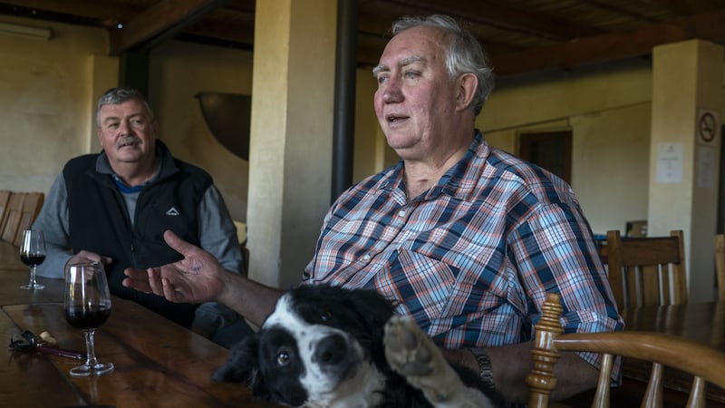 Wine farmer Stefan Smit drinks with friends at the Louiesenhof Wines farm which is adjacent to the Kayamandi township outside of Stellenbosch, South Africa. Photograph:Joao Silva/The New York Times
