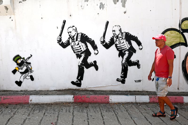 A mural titled 'Rrun' by artist Alexsandro Palombo depicting Israeli prime minister Binyamin Netanyahu and politician Gadi Eisenkot in Tel Aviv. Photograph: Jack Guez/AFP/Getty