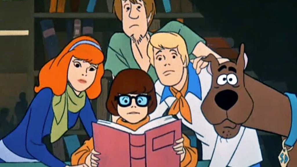 Velma, holding the book, surrounded by Daphne, Shaggy, Fred and Scooby in the original cartoon, which first appeared in 1969. Photograph:  Hanna-Barbera