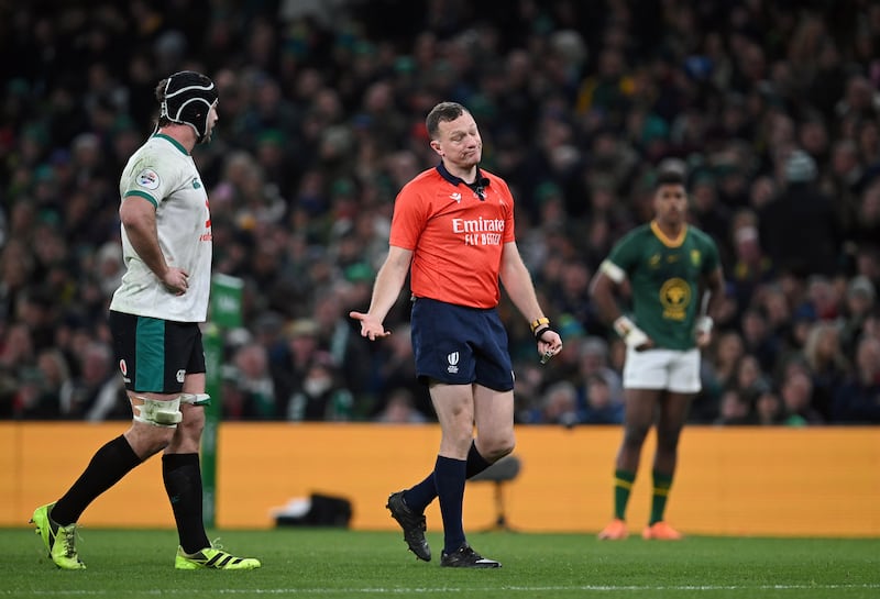 Referee Matthew Carley speak to Ireland captain Caelan Doris during the game. Photograph: Charles McQuillan/Getty Images