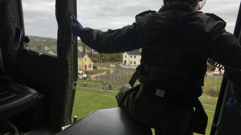 A member of the EAS crew helps guide the helicopter pilot as he lands the aircraft. Photograph: Peter Murtagh